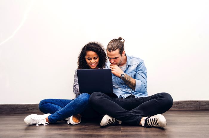 Two people at laptop